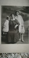 Antique photo of ladies from 1916 kiss Joseph Joseph in his own house