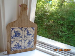Hand painted delft tile insert wall decoration on wooden cutting board