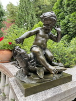 Pigalle: an antique bronze statue of a putto teasing a crab!!!!