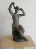 Nude smoothing her hair. Marked ceramic sculpture. Medvedczky.