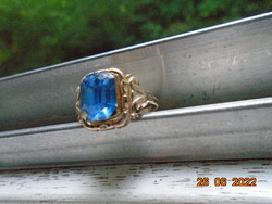 Silver-plated ring with a sapphire-colored polished stone
