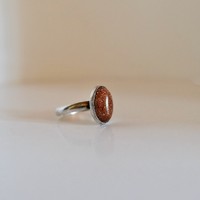 Silver ring with a brown stone