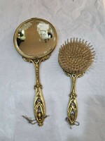 Old hand mirror with brush