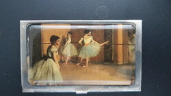 Metal business card holder with a print of a Degas painting