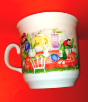 A beautiful cocoa mug with a fairy-tale pattern and a ladybug
