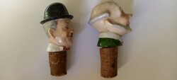 Two pieces, old glass bottle stopper porcelain(?) Head. Stan and pan or chaplin(?)