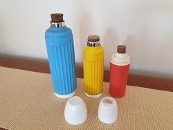 Old retro drinking thermos with glass insert, colorful plastic thermos bottle