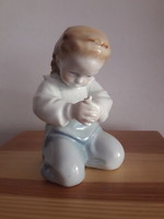 A very rare Zsolnay Sincó figurine of a child who hurts his finger and prays