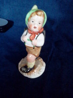 Ceramic nipp statue of a boy with a school bag