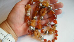 Carnelian necklace with small metal spacers.