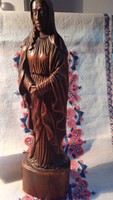 A statue of Mary carved from a block of wood. About 120 years old