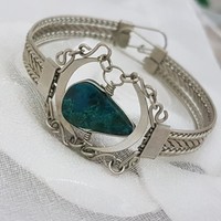 Silver-plated bracelet with turquoise stones.