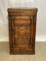 Carved cabinet with a hunting scene marked 