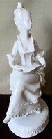 Dt/085 - woman from Hóllóháza, in baroque dress, reading sheet music, porcelain figurine with underglaze