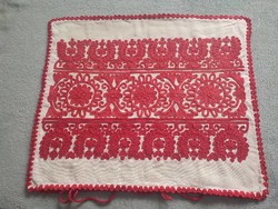 Richly embroidered decorative cushion cover with Transylvanian writing.
