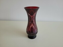 Old burgundy crystal vase with polished glass vase