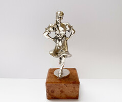 Old silver figure of a folk dancer on a marble base, marked.