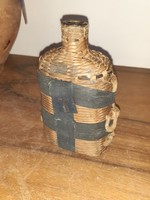 Regi glass bottle, in a wicker case