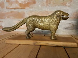 Copper nutcracker dog on wooden sole