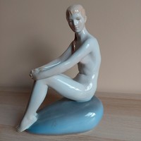 A rare collector's Turkish János Zsolnay female nude figure sitting on a stone