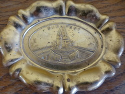 An old metal ashtray from a small pub with a Budapest cityscape