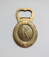 Old copper beer opener with the letter k