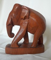 Hand-carved teak elephant statue from Thailand, also suitable as a bookend