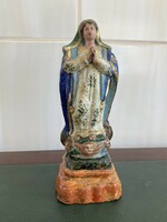 Virgin Mary statue is a Christian religious object