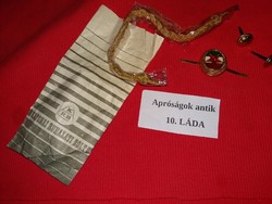 Old military badges and gold officer's cord in contemporary military shop stanecli as shown in the pictures
