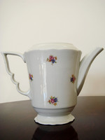 Old zsolnay porcelain teapot with floral tea pouring