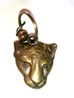 Bronze leopard head whistle 64.