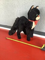 Collectible large German mohair black cat with green eyes.