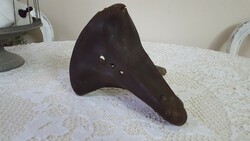 Old, retro spring leather bicycle saddle