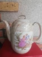 Antique teapot with a romantic scene