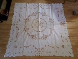 Embroidered snow-white rosette tablecloth.