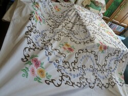 Old, but in good condition, hand-embroidered tablecloth, curtain, bedspread.