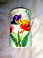 Elegant, fine porcelain tea mug with a romantic tulip pattern