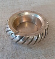 A table ornament /ashtray/ that can also be used as an ashtray depicting an old copper rare car tire