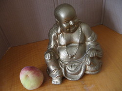 Buddha statue sitting, pot-bellied, smiling