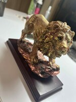 Gold-bronze colored lion ornament figure