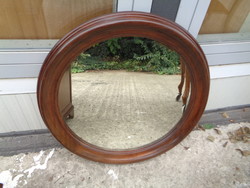 Round mirror, in a wooden frame