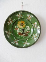Green glazed folk ceramic wall plate