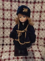 Porcelain doll in winter clothes with stand for sale
