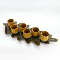 Ceramic acorn cups on oak leaf serving