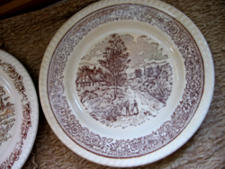 Brown and white scene of English plate in village, chatting couple