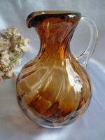 Old broken, handmade glass jug.