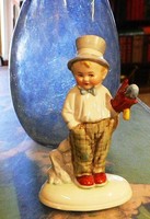 Germany porcelain. Little boy in hat with umbrella