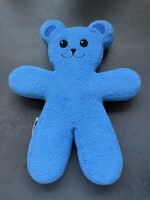 A blue Ikea-Unicef teddy bear with bendable limbs