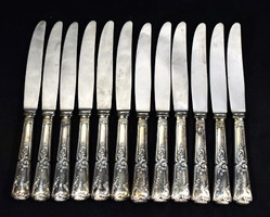 A sumptuous neo-rococo set of 12 knives with silver-plated handles!