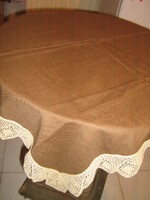 Elegant brown tablecloth with a beautiful hand-crocheted edge